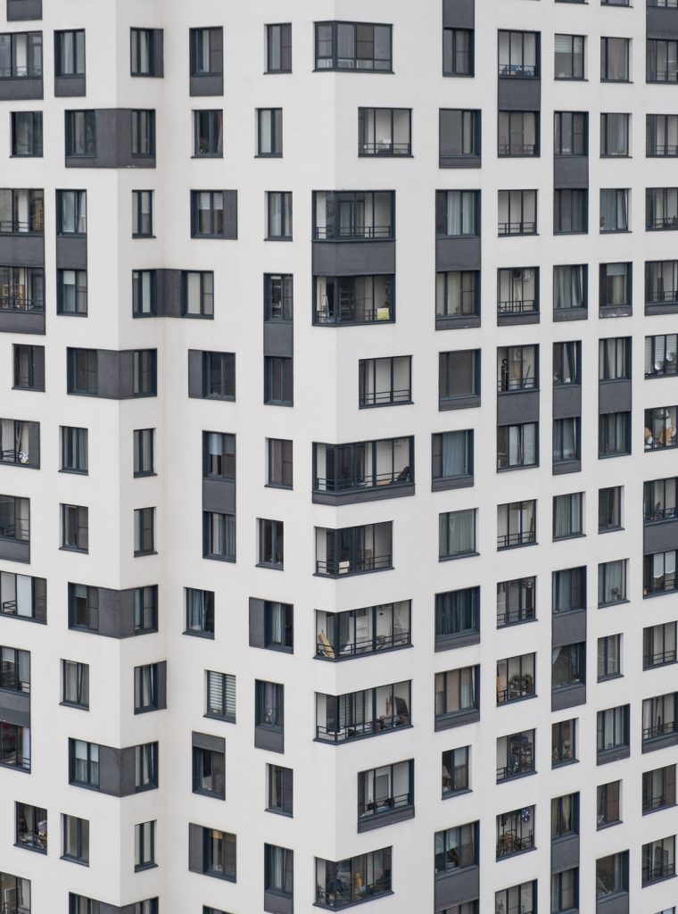 New apartment buildings with windows and balconies. Modern european complex of apartment buildings. And outdoor facilities. Mixed media